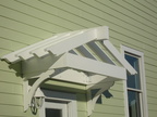 Decorative over the door pergola with CNC braces for support