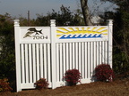Custom entry fence with painted CNC designs and solar lights