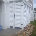 Louvered shower with accent top